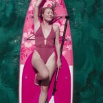 lady on a stand up paddle