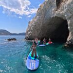 Group Of Girls coming out from a cave on turtle island