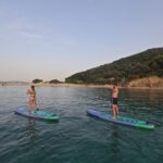 A Couple SUPing on Sunset Marathonisi