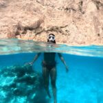 a girl diving in blue color water