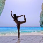 A girl in a bikini dancing in eros cave zakynthos